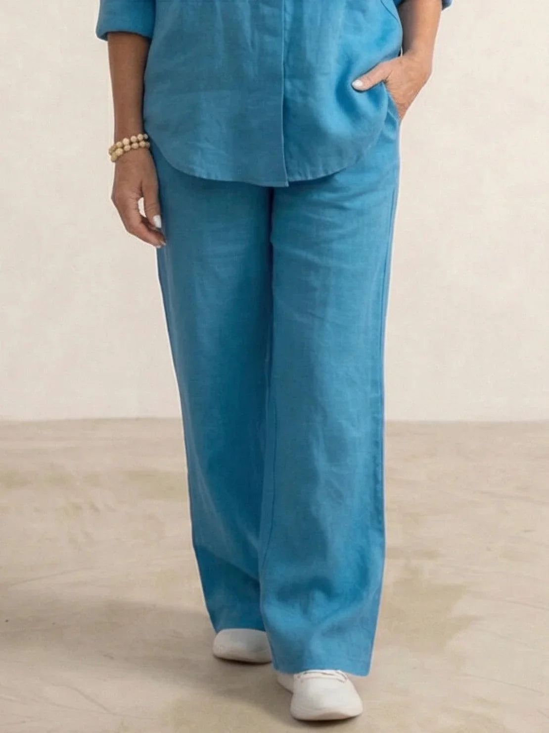 Women's casual linen set with button-down collared shirt and wide-leg pants