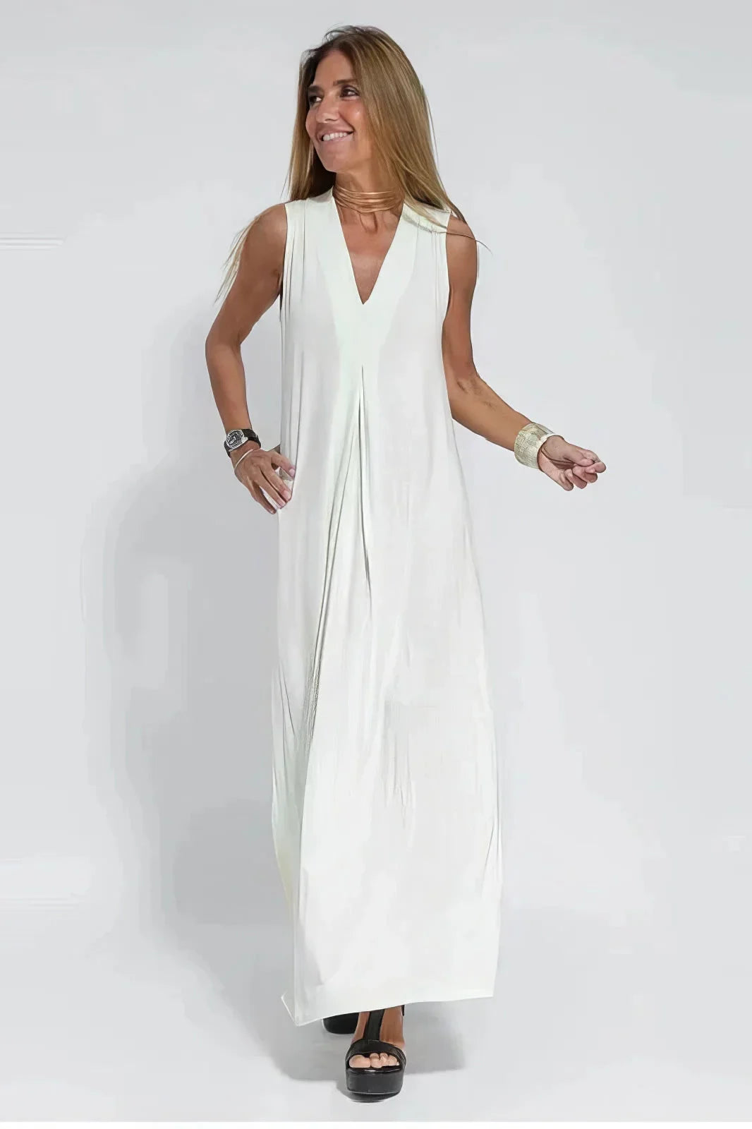 Women's knit flowy maxi dress with sleeveless V-neck and draped front